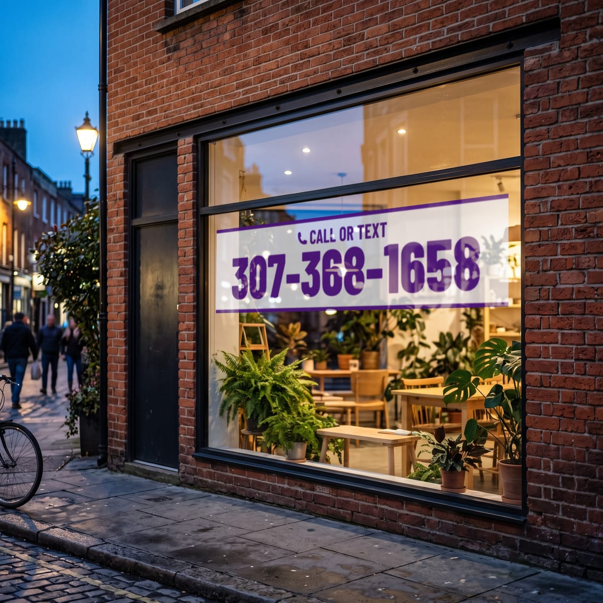(307) 368-1658 on a shop window