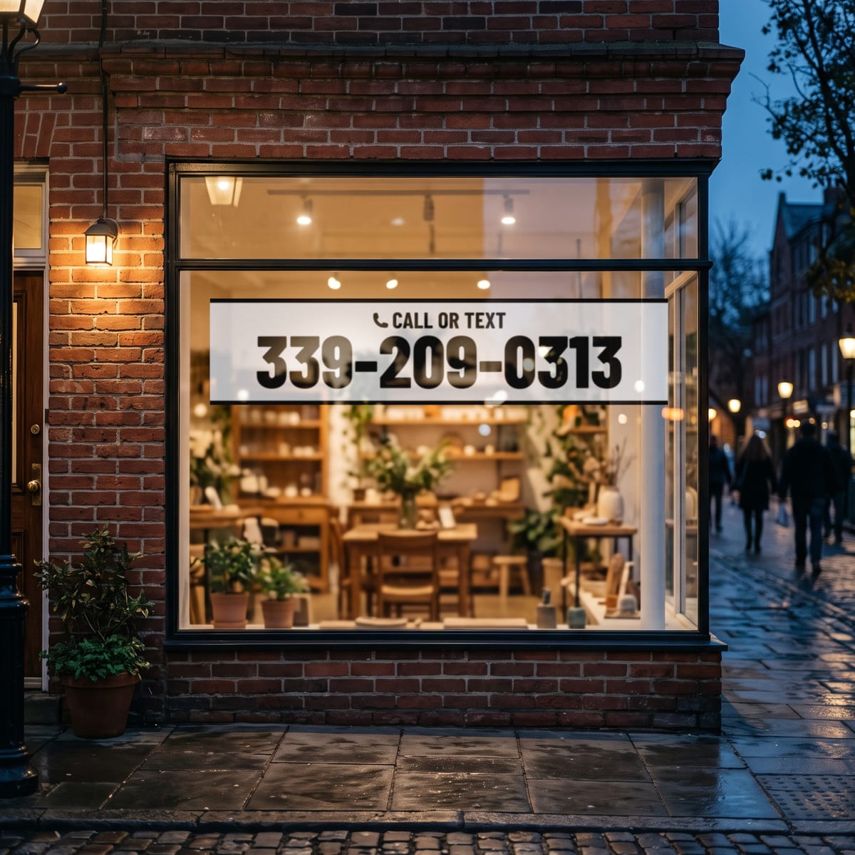 (339) 209-0313 on a shop window