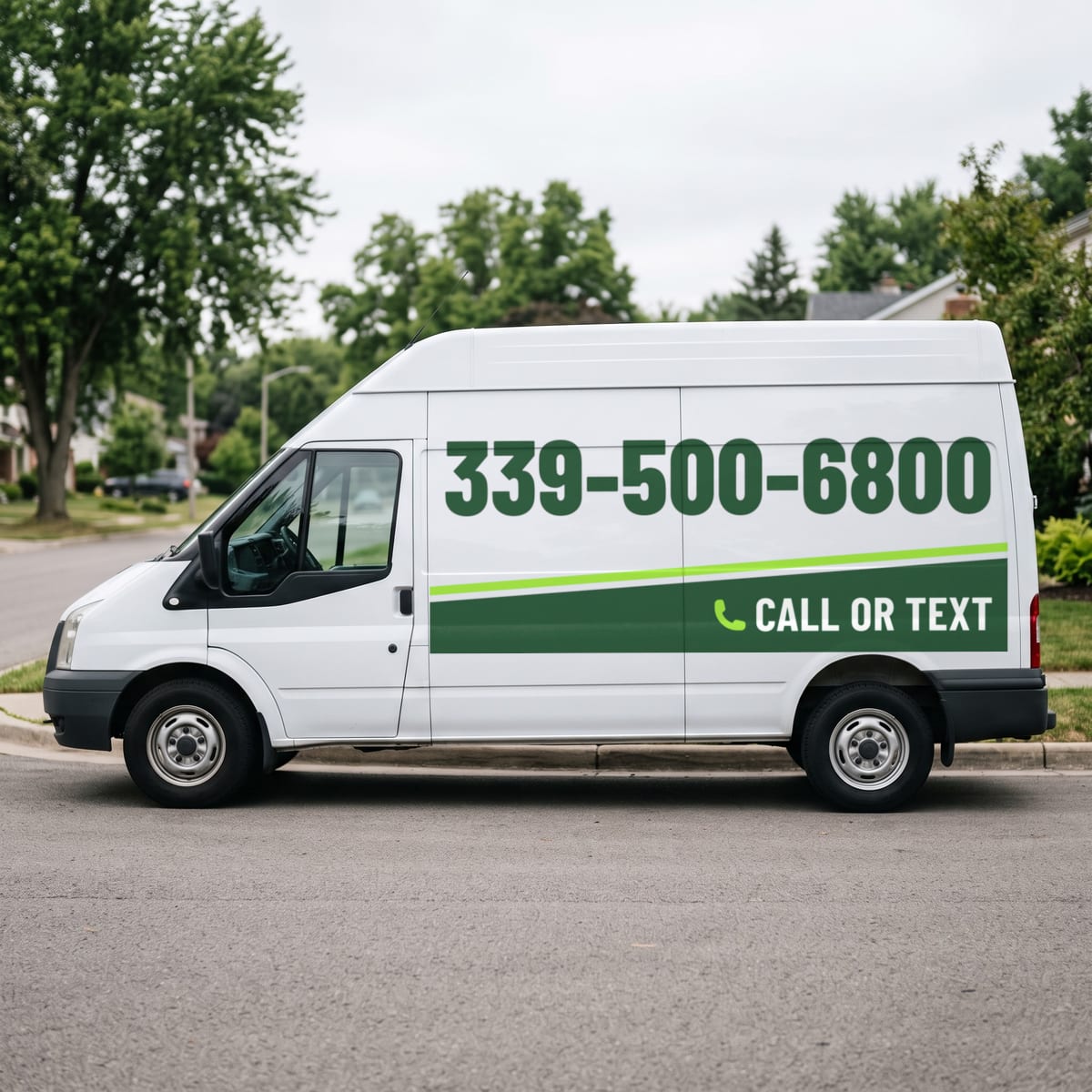 (339) 500-6800 painted on a work van
