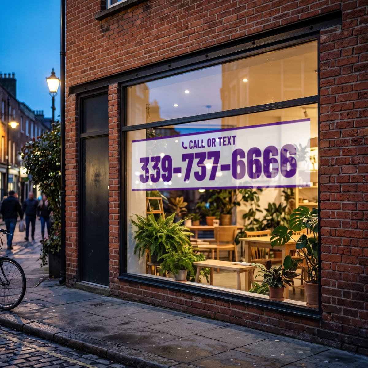 (339) 737-6666 on a shop window