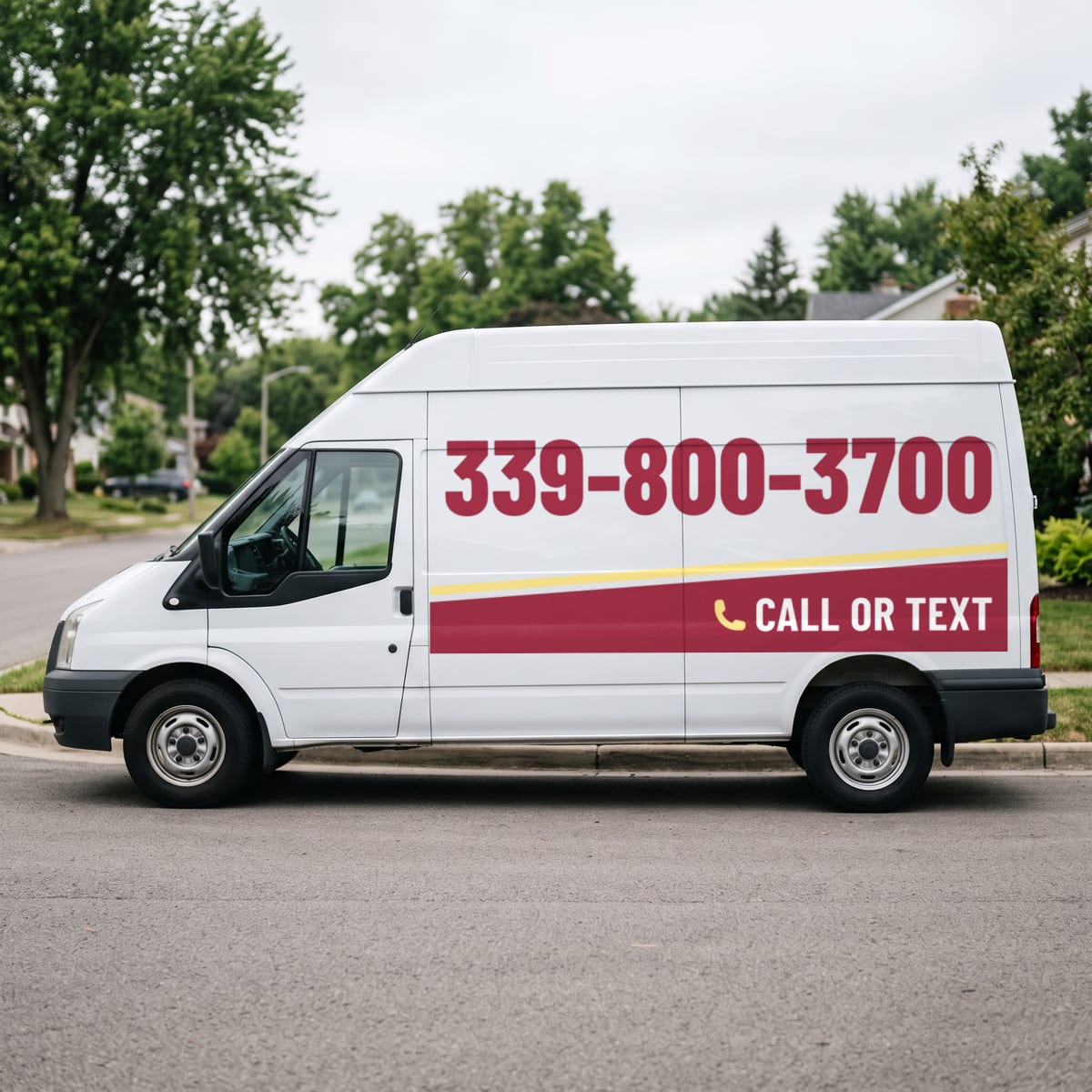 (339) 800-3700 painted on a work van