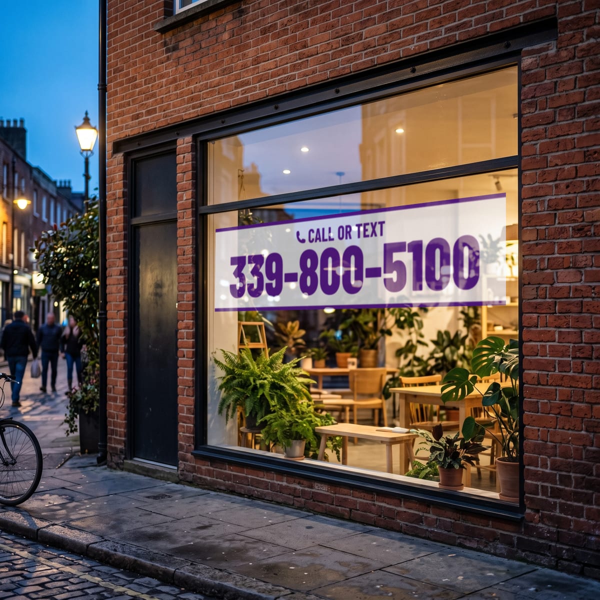 (339) 800-5100 on a shop window