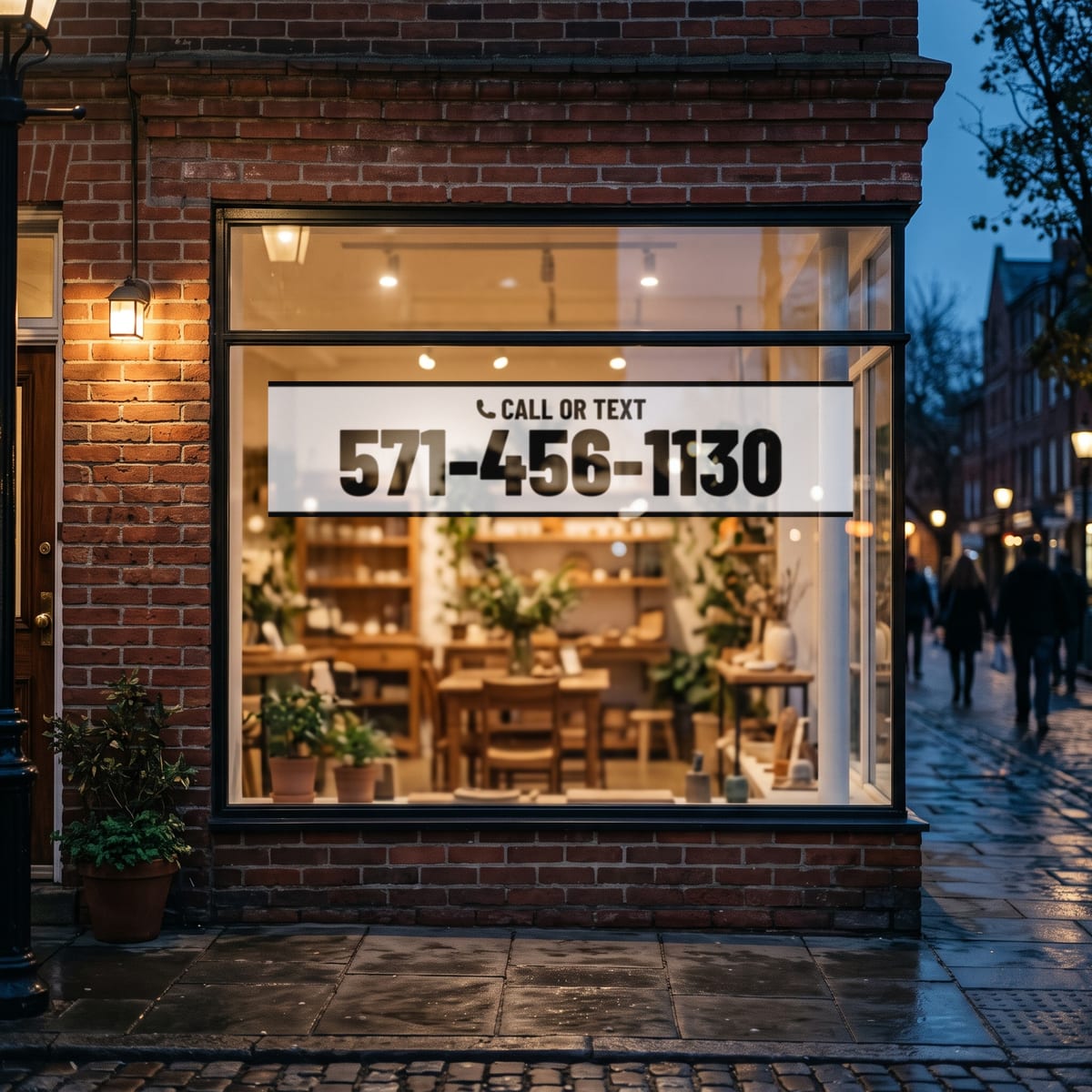 (571) 456-1130 on a shop window