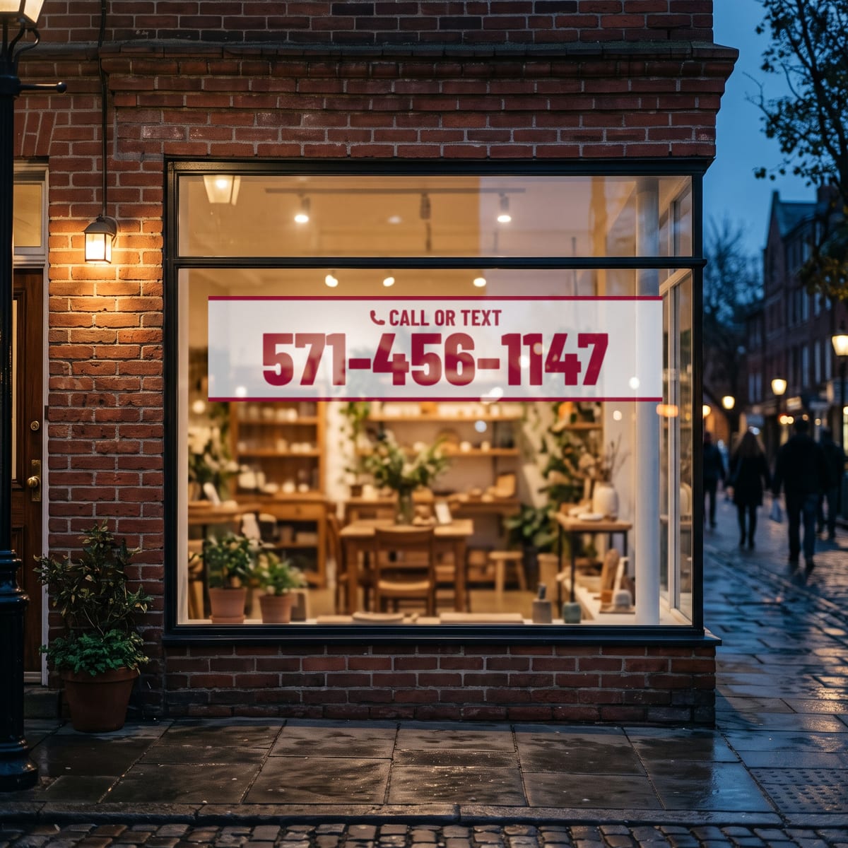 (571) 456-1147 on a shop window