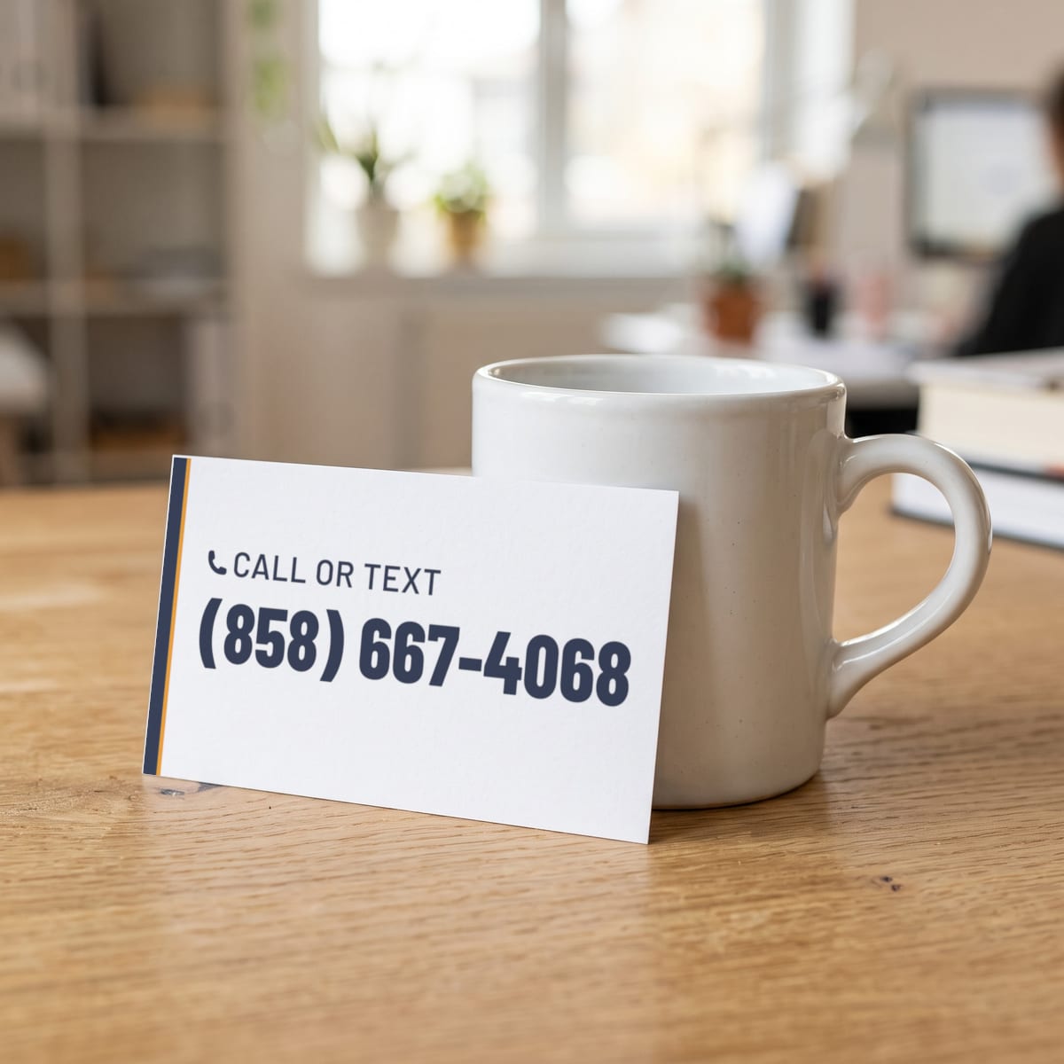 (858) 667-4068 on a business card